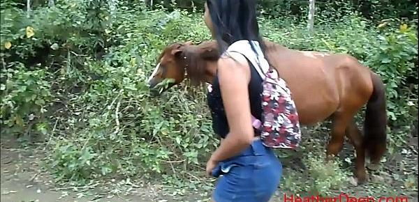  peeing next to horse in jungle